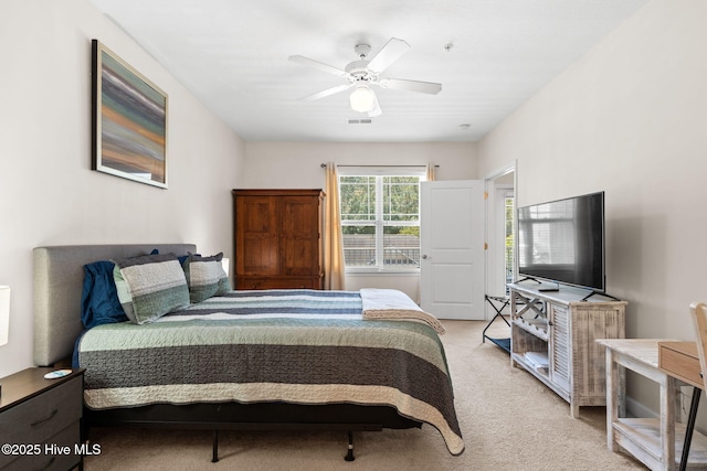 235 Woodlands Way Unit 9, Calabash, NC 28467 - bedroom featuring light colored carpet and a ceiling fan