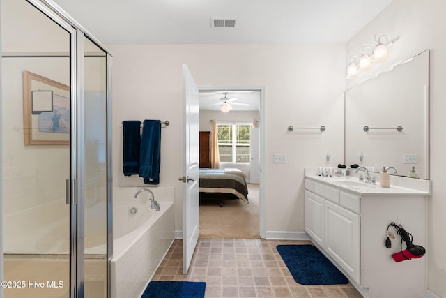 235 Woodlands Way Unit 9, Calabash, NC 28467 - full bath with ensuite bath, vanity, a garden tub, a stall shower, and ceiling fan