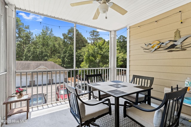235 Woodlands Way Unit 9, Calabash, NC 28467 - sunroom with ceiling fan, outdoor dining space, and view of wooded area
