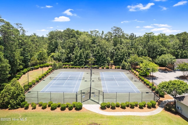 235 Woodlands Way Unit 9, Calabash, NC 28467 - view of tennis court featuring a forest view
