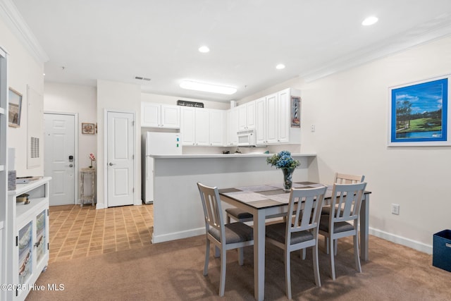 235 Woodlands Way Unit 9, Calabash, NC 28467 - dining area featuring crown molding, light carpet, and recessed lighting