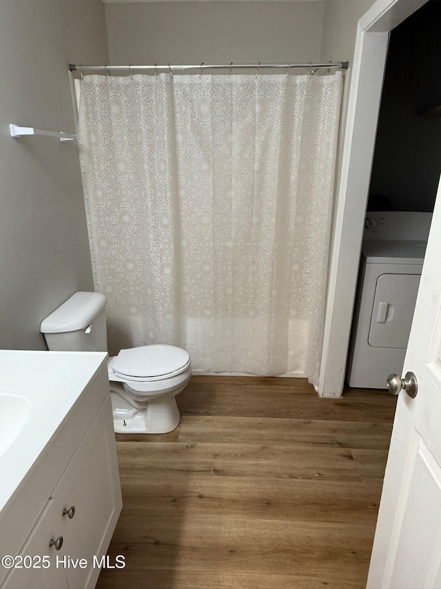 1415 Glenn St, Wilmington, NC 28401 - bathroom featuring vanity, washer / clothes dryer, and wood finished floors