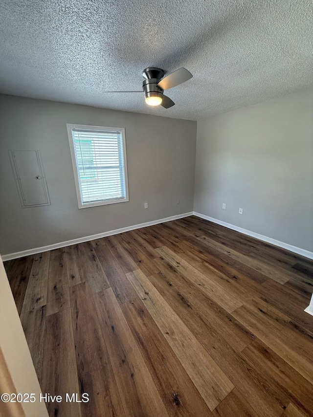 1415 Glenn St, Wilmington, NC 28401 - spare room with electric panel, dark wood-style floors, ceiling fan, and a textured ceiling