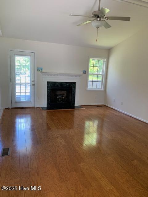 208 Canterwood Ln, New Bern, NC 28562 - unfurnished living room with a high end fireplace, a ceiling fan, and wood finished floors