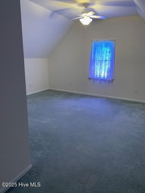 208 Canterwood Ln, New Bern, NC 28562 - additional living space with vaulted ceiling, ceiling fan, and dark carpet