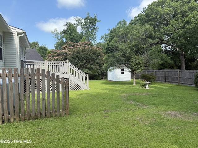 208 Canterwood Ln, New Bern, NC 28562 - fenced backyard with a storage unit, stairs, and a wooden deck