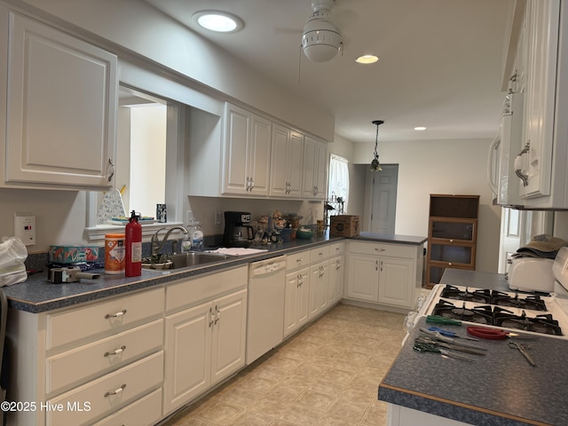 208 Canterwood Ln, New Bern, NC 28562 - kitchen with white appliances, dark countertops, a ceiling fan, a peninsula, and recessed lighting