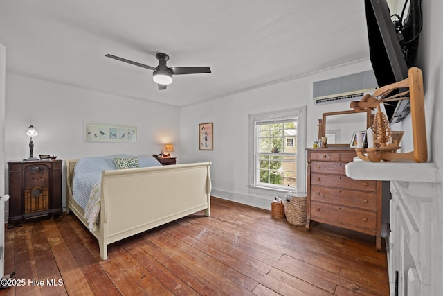 409 Hancock St, New Bern, NC 28560 - bedroom featuring a wall mounted air conditioner, hardwood / wood-style flooring, and a ceiling fan