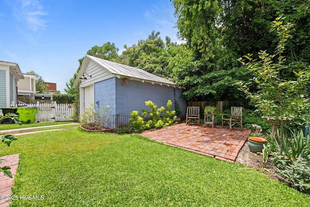 409 Hancock St, New Bern, NC 28560 - view of yard featuring an outbuilding and a patio
