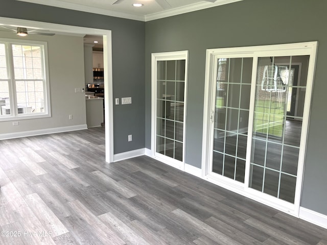 407 King Richard Ct, Jacksonville, NC 28546 - unfurnished room with a ceiling fan, ornamental molding, and wood finished floors