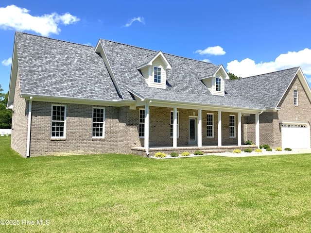 407 King Richard Ct, Jacksonville, NC 28546 - new england style home with brick siding, roof with shingles, covered porch, and a front lawn