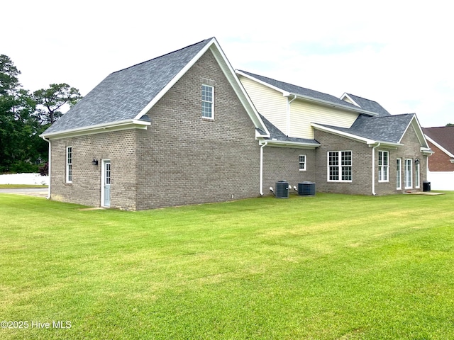 407 King Richard Ct, Jacksonville, NC 28546 - view of property exterior featuring brick siding, a lawn, and roof with shingles