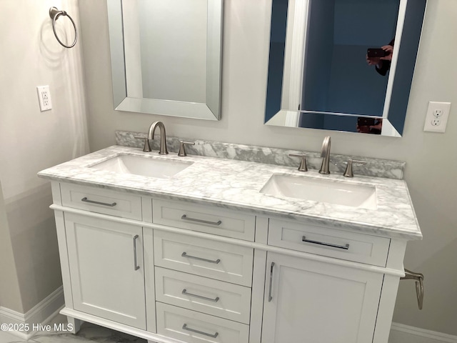 407 King Richard Ct, Jacksonville, NC 28546 - bathroom featuring double vanity and baseboards