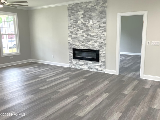407 King Richard Ct, Jacksonville, NC 28546 - unfurnished living room featuring a ceiling fan, dark wood-type flooring, crown molding, and a fireplace