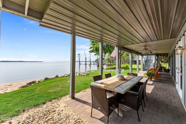 938 E Bayside Dr, Chocowinity, NC 27817 - view of patio / terrace featuring a water view, stairway, outdoor dining space, and ceiling fan