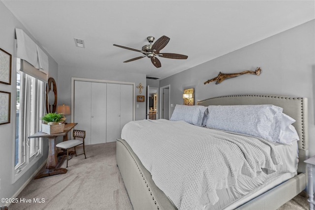 938 E Bayside Dr, Chocowinity, NC 27817 - bedroom with a closet, light carpet, and ceiling fan