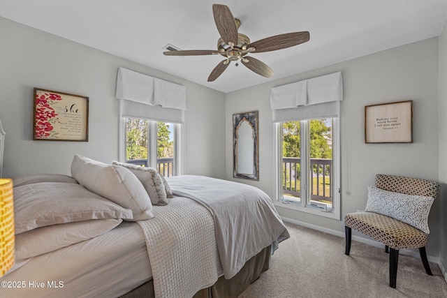 938 E Bayside Dr, Chocowinity, NC 27817 - carpeted bedroom with multiple windows, access to exterior, and ceiling fan