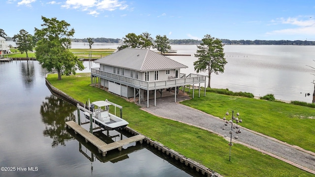 938 E Bayside Dr, Chocowinity, NC 27817 - dock with boat lift, a deck with water view, and a lawn