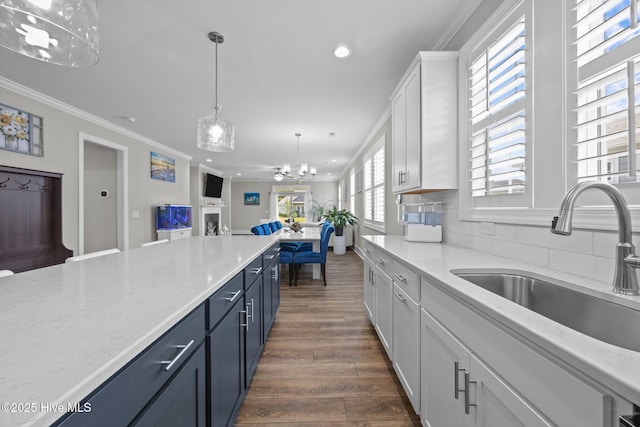 184 Twining Rose Ln, Holly Ridge, NC 28445 - kitchen featuring recessed lighting, a chandelier, white cabinetry, open floor plan, and ornamental molding