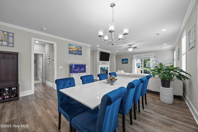 184 Twining Rose Ln, Holly Ridge, NC 28445 - dining area featuring a chandelier, dark wood-style flooring, crown molding, recessed lighting, and a ceiling fan
