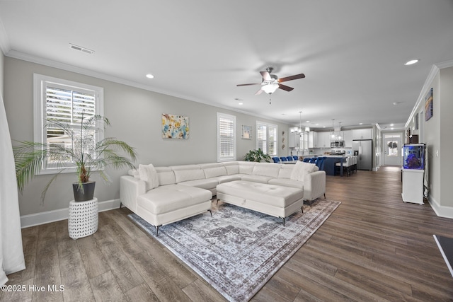 184 Twining Rose Ln, Holly Ridge, NC 28445 - living room with recessed lighting, a ceiling fan, crown molding, dark wood-type flooring, and a chandelier