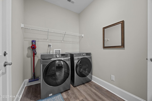 184 Twining Rose Ln, Holly Ridge, NC 28445 - laundry area featuring washing machine and clothes dryer and wood finished floors