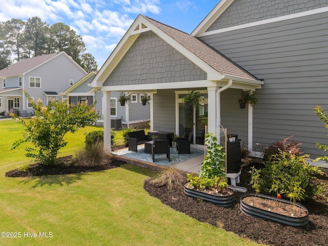 184 Twining Rose Ln, Holly Ridge, NC 28445 - back of house with a lawn, a patio, and an outdoor living space