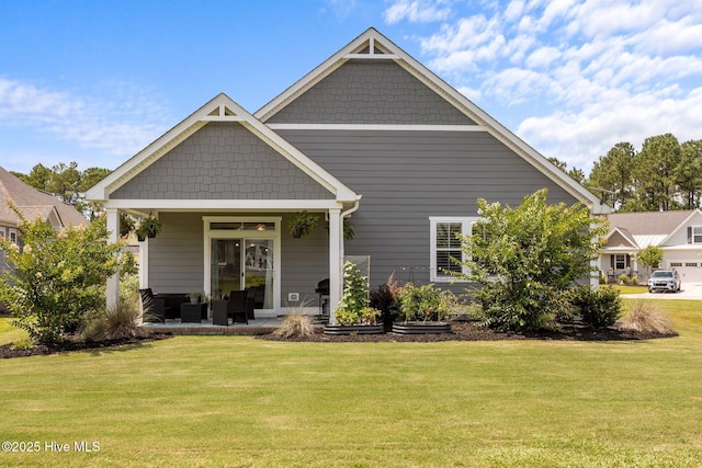 184 Twining Rose Ln, Holly Ridge, NC 28445 - back of house with a lawn and covered porch