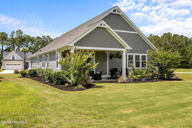184 Twining Rose Ln, Holly Ridge, NC 28445 - view of front of house featuring a front yard and a detached garage