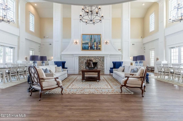 184 Twining Rose Ln, Holly Ridge, NC 28445 - living room with a towering ceiling, a chandelier, healthy amount of natural light, and wood finished floors