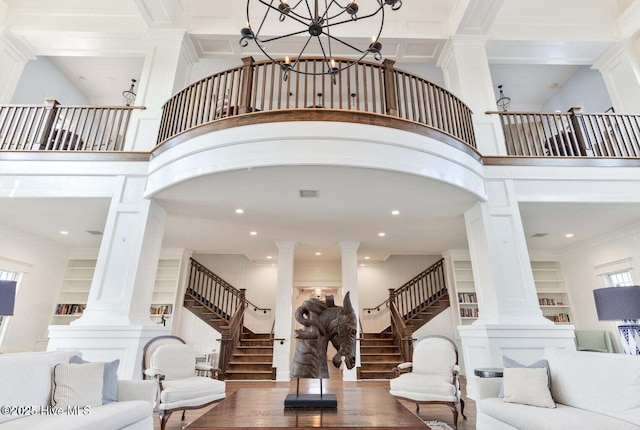 184 Twining Rose Ln, Holly Ridge, NC 28445 - living area featuring ornate columns, stairway, wood finished floors, ornamental molding, and built in shelves