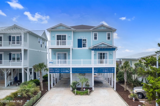 328 E First St, Ocean Isle Beach, NC 28469 - coastal inspired home with a carport and driveway