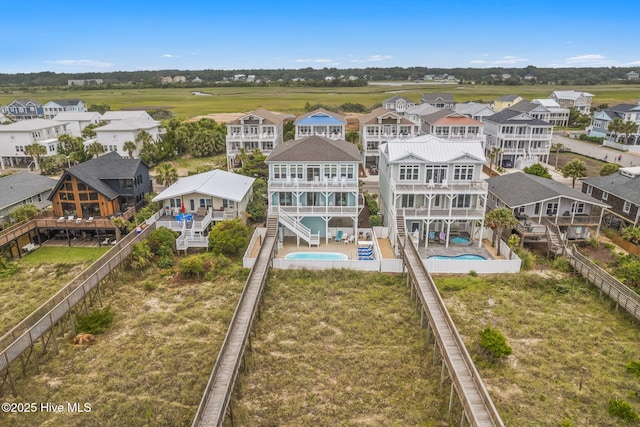 328 E First St, Ocean Isle Beach, NC 28469 - aerial perspective of suburban area with a pool area