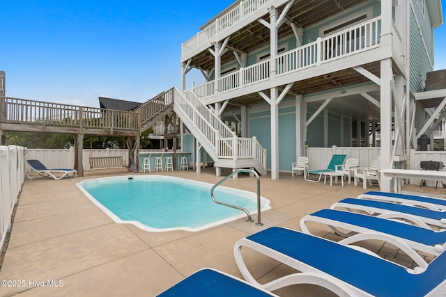 328 E First St, Ocean Isle Beach, NC 28469 - view of swimming pool featuring stairway and a patio area