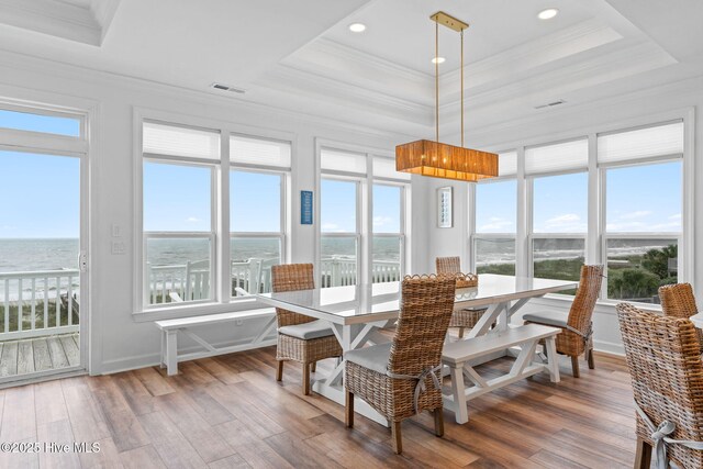 328 E First St, Ocean Isle Beach, NC 28469 - sunroom / solarium with healthy amount of natural light and a water view