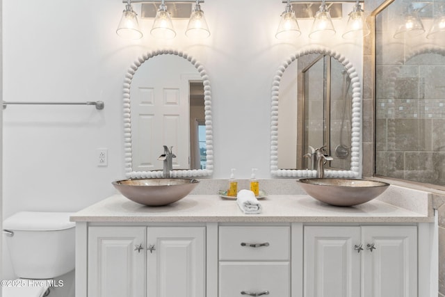 328 E First St, Ocean Isle Beach, NC 28469 - full bathroom featuring toilet and double vanity