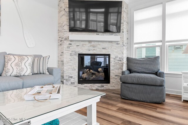 328 E First St, Ocean Isle Beach, NC 28469 - living area featuring wood finished floors and a fireplace