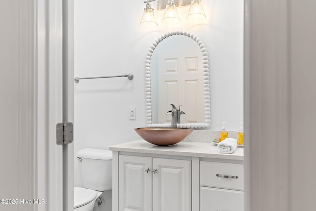 328 E First St, Ocean Isle Beach, NC 28469 - bathroom featuring vanity and a chandelier