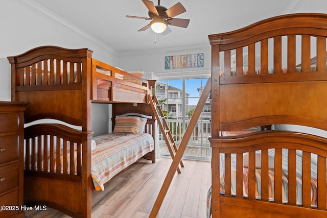 328 E First St, Ocean Isle Beach, NC 28469 - bedroom with access to exterior, crown molding, and wood finished floors