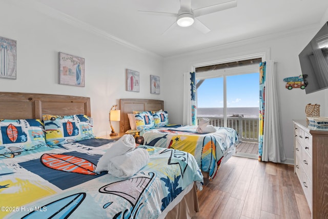 328 E First St, Ocean Isle Beach, NC 28469 - bedroom featuring access to exterior, light wood finished floors, ornamental molding, and ceiling fan