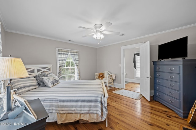 209 E Main St, Washington, NC 27889 - bedroom with ornamental molding, light wood-style flooring, and a ceiling fan