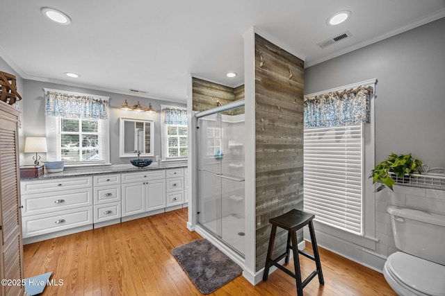 209 E Main St, Washington, NC 27889 - bathroom featuring ornamental molding, vanity, a shower stall, wood finished floors, and recessed lighting