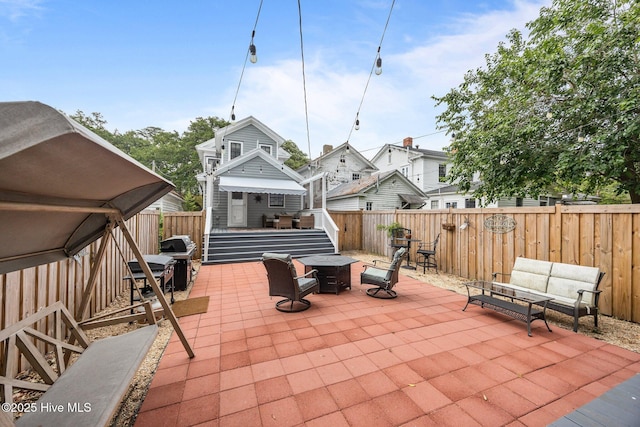 209 E Main St, Washington, NC 27889 - fenced backyard featuring a patio area and an outdoor fire pit
