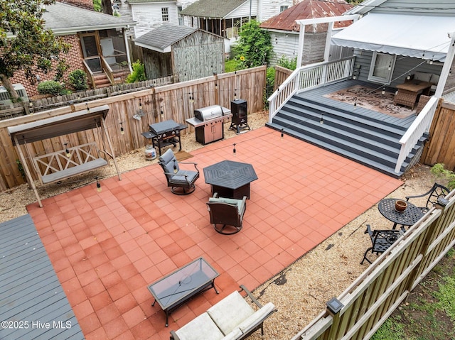 209 E Main St, Washington, NC 27889 - view of patio / terrace featuring a deck, a storage shed, and area for grilling