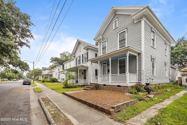 209 E Main St, Washington, NC 27889 - view of front of property with a porch, crawl space, and a residential view