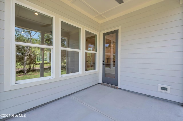5988 Gray Squirrel Path, Southport, NC 28461 - view of exterior entry featuring a patio area