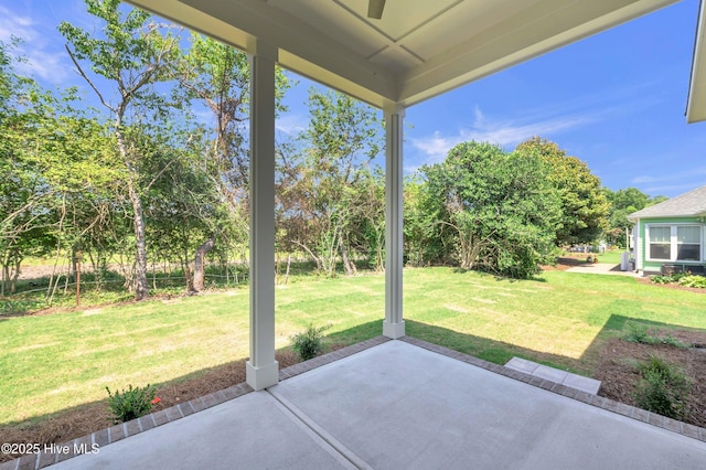 5988 Gray Squirrel Path, Southport, NC 28461 - view of patio / terrace with view of scattered trees