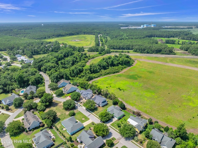 5988 Gray Squirrel Path, Southport, NC 28461 - aerial perspective of suburban area featuring a heavily wooded area