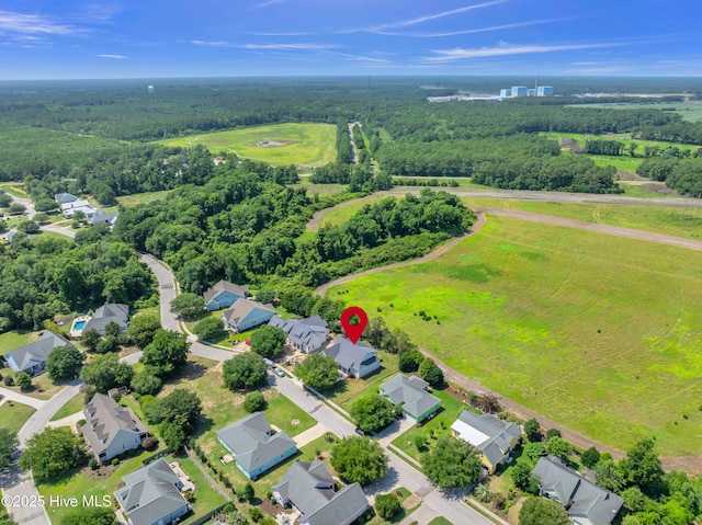 5988 Gray Squirrel Path, Southport, NC 28461 - aerial perspective of suburban area with a heavily wooded area