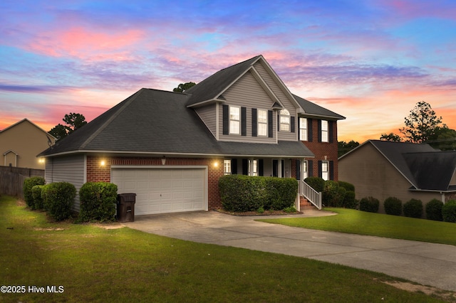 225 Woodshire Dr, Lillington, NC 27546 - traditional-style home featuring a garage, concrete driveway, brick siding, and a porch